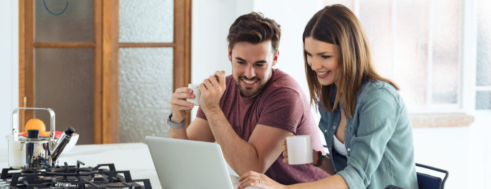 Couple using laptop